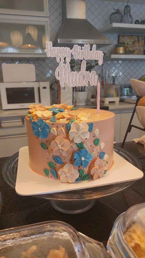 Peach Floral Buttercream Cake topped with Happy Birthday Mudra